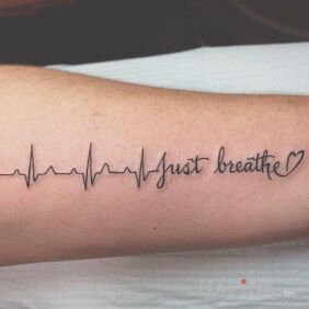 Tattoo Inscription with a heart on the forearm motif: lettering