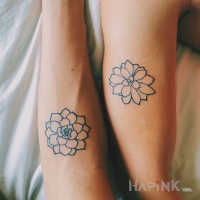 Tattoo Two flowers on the upper arm motif: Love