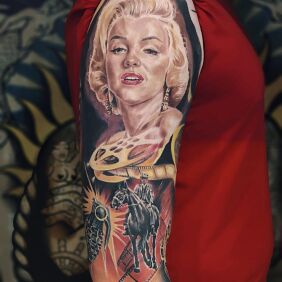 Tattoo Marilyn Monroe On the arm motif: faces style: realistic
