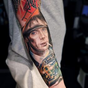 Tattoo Tommy Shelby on the forearm motif: characters style: realistic