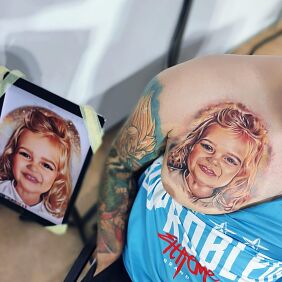 Tattoo Portrait of a Daughter on the chest motif: faces style: realistic