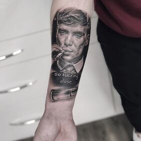 Tattoo Tommy Shelby On the arm motif: faces style: realistic