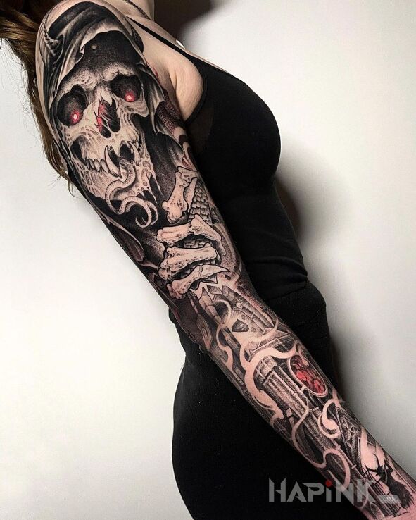 Tattoo Nieumarły in black and gray motif and graphic / illustrative style on the upper arm