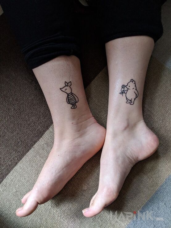 Tattoo Puchatek i Prosiaczek in black and gray motif and contour / linework style near the ankle