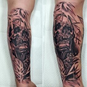 Tattoo Skull and raven on the forearm motif: dark style: graphic / illustrative