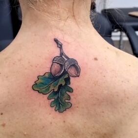 Tattoo Acorns on the back motif: colorful style: neo-traditional