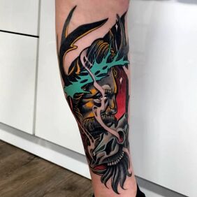 Tattoo Cernunnos on the calf motif: colorful style: neo-traditional