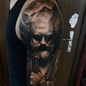 Tattoo Viking On the arm motif: black and gray style: realistic