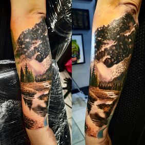 Tattoo Mountain landscape on the forearm motif: nature style: realistic