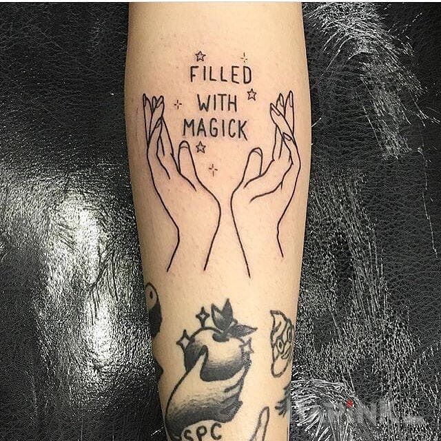 Tattoo Magia in lettering motif on the forearm