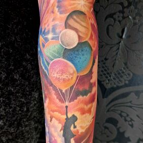 Tattoo Colorful girl with balloons on the forearm motif: characters style: graphic / illustrative