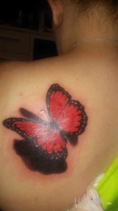 Tattoo Motylek in butterflies motif on the shoulder blades