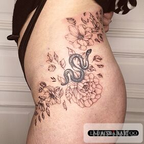 Tattoo Flowers on the hip on the thigh motif: black and gray style: graphic / illustrative