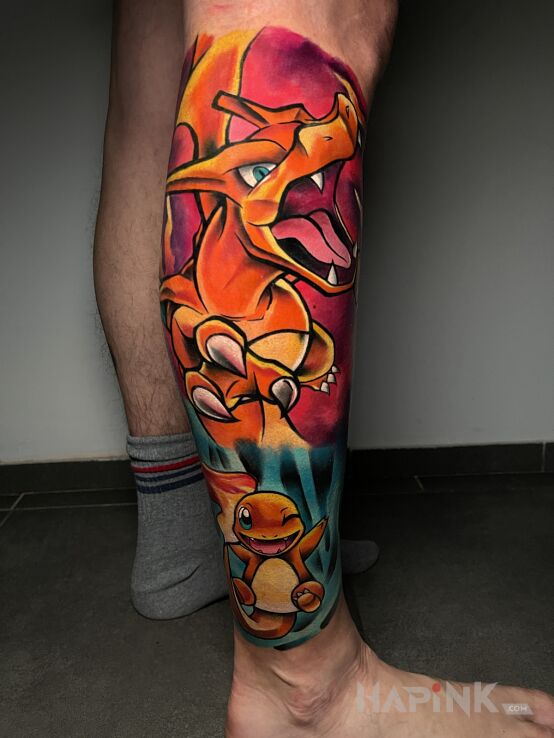 Tattoo POKEMON ANIME CHARIZARD in colorful motif and cartoon / comic book style on the calf