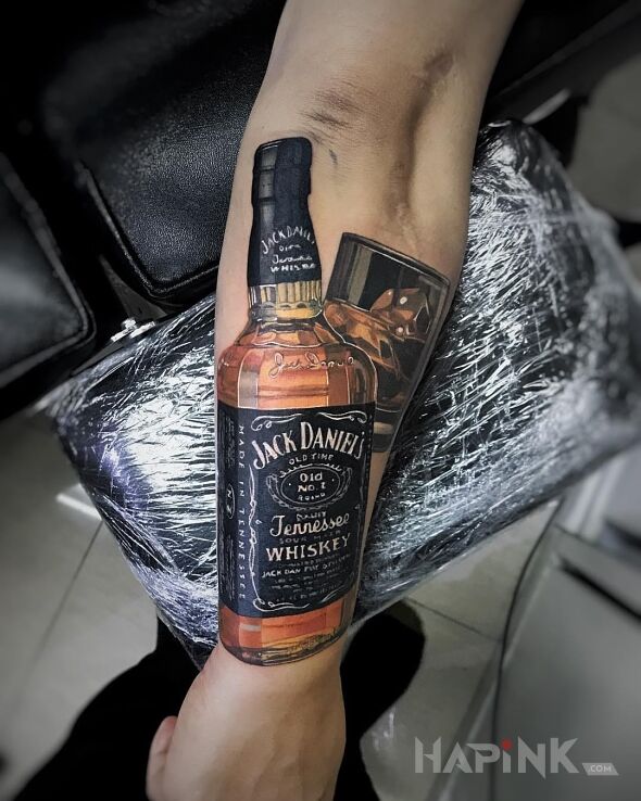Tattoo Jack Daniells in 3D motif and realistic style on the forearm