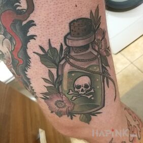 Tattoo Poison tattoo on the thigh motif: skulls style: graphic / illustrative