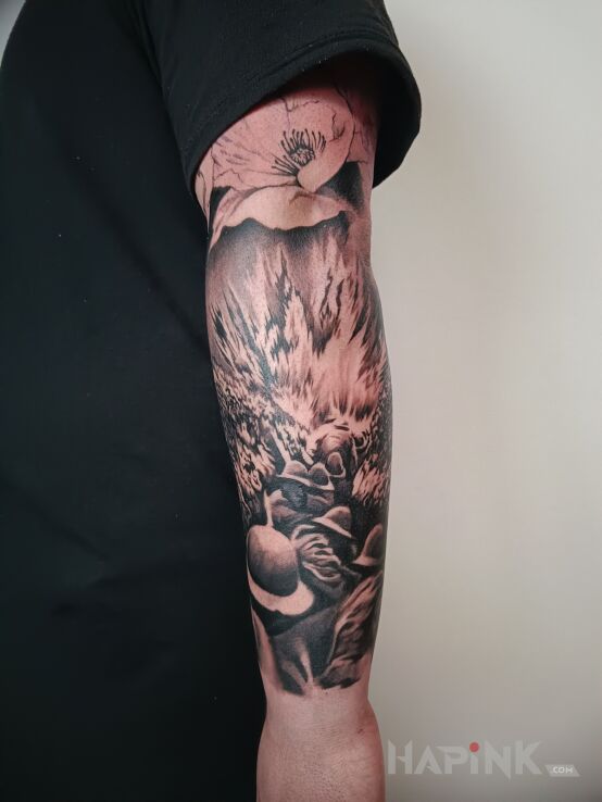 Tattoo Wojna in black and gray motif and realistic style on the forearm