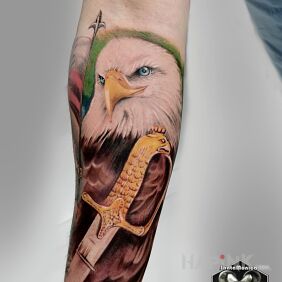 Tattoo Eagle On the arm motif: colorful style: realistic
