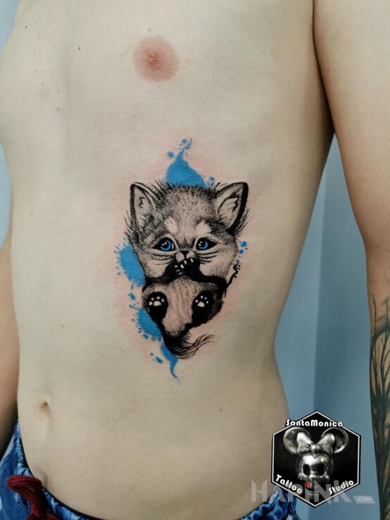 Tattoo Słodziak in black and gray motif and graphic / illustrative style on the ribs