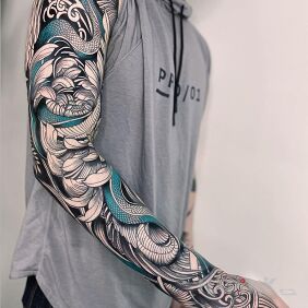 Tattoo Blue snake on the hand motif: flowers style: graphic / illustrative