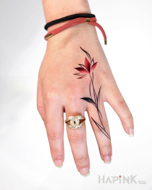 Tattoo Tulip in małe motif and graphic / illustrative style on the hand