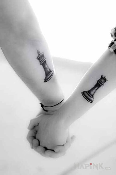 Tattoo K&Q in Love motif on the forearm