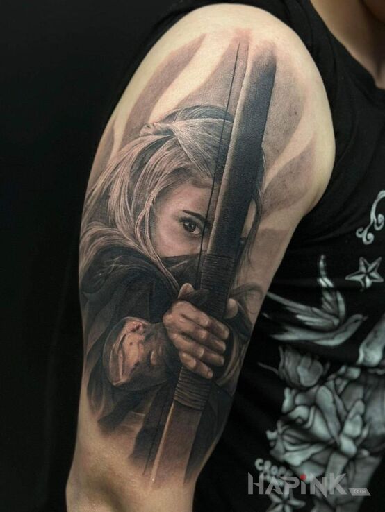 Tattoo Łuczniczka in characters motif and realistic style On the arm