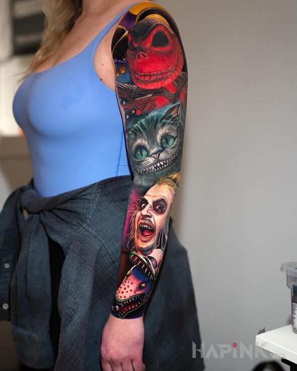 Tattoo Same swirusy in faces motif and realistic style on the forearm