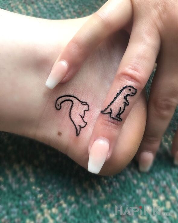 Tattoo Dinusie in Love motif and minimalistic style on the foot