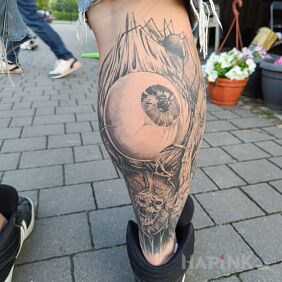 Tattoo Eye on the calf motif: black and gray style: graphic / illustrative