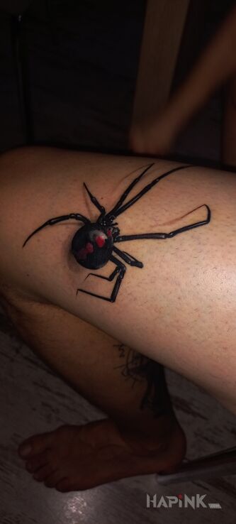 Tattoo Spider in 3D motif and realistic style on the thigh