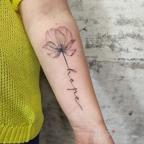 Tattoo Flower with inscription On the arm motif: black and gray style: calligraphy