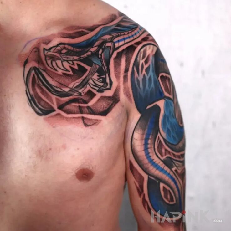 Tattoo Snake in nature motif and newschool style on the upper arm