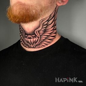 Tattoo Winged diamond on the throat motif: black and gray style: graphic / illustrative