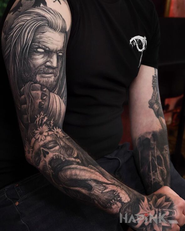 Tattoo Geralt from Rivia in dark motif and graphic / illustrative style on the upper arm