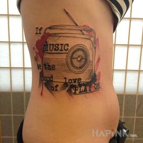 Tattoo About music on the ribs motif: lettering