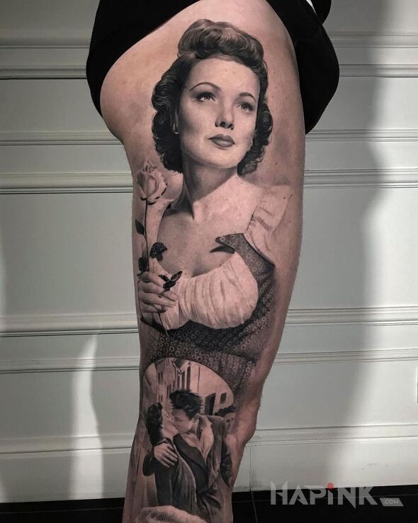 Tattoo Portret podkreślony pocałunkiem in faces motif and realistic style on the thigh