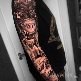Tattoo Devourer of human heads on the forearm motif: dark style: realistic