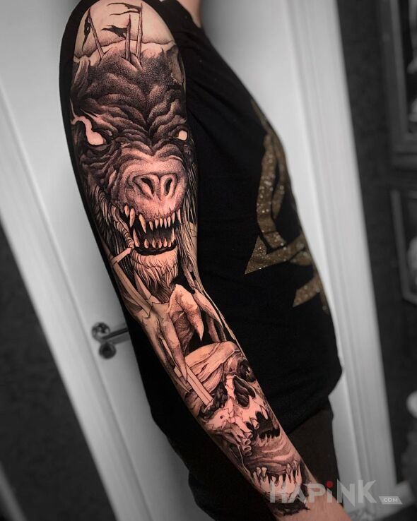 Tattoo Pożeracz ludzkich głów in skulls motif and realistic style on the upper arm