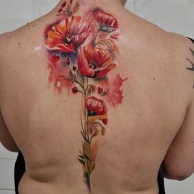 Tattoo Poppies on the back on the back motif: colorful style: realistic
