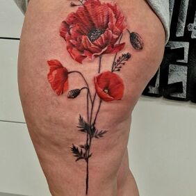 Tattoo Poppies on the thigh on the thigh motif: flowers style: realistic