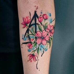 Tattoo Floral composition On the arm motif: colorful style: graphic / illustrative