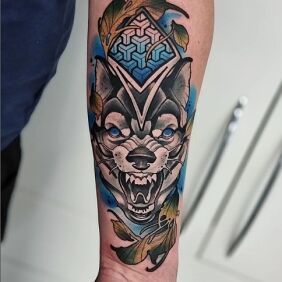 Tattoo Wolf on the forearm motif: floral style: neo-traditional