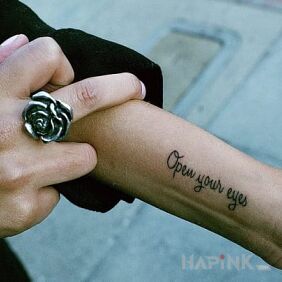 Tattoo Short caption on the forearm motif: lettering
