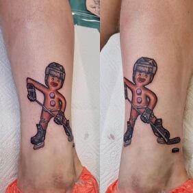 Tattoo Cookie Hockey Player on the calf motif: funny style: graphic / illustrative
