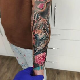 Tattoo She-wolf on the forearm motif: colorful style: realistic