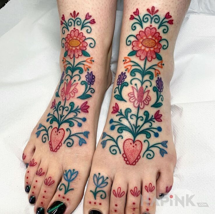 Tattoo Folkowo in colorful motif and graphic / illustrative style on the foot