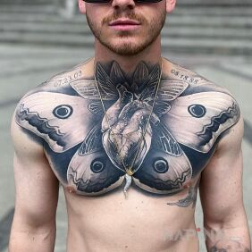 Tattoo Black heart on the chest motif: anatomical style: realistic