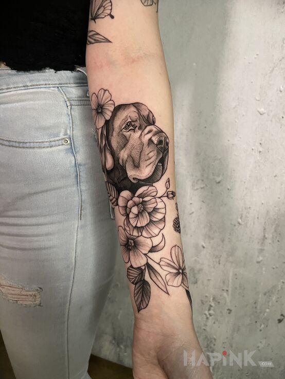 Tattoo Pieseł od Sierpki! in black and gray motif and graphic / illustrative style On the arm