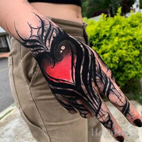 Tattoo Heart with a twist on the fingers motif: other style: blackwork / blackout